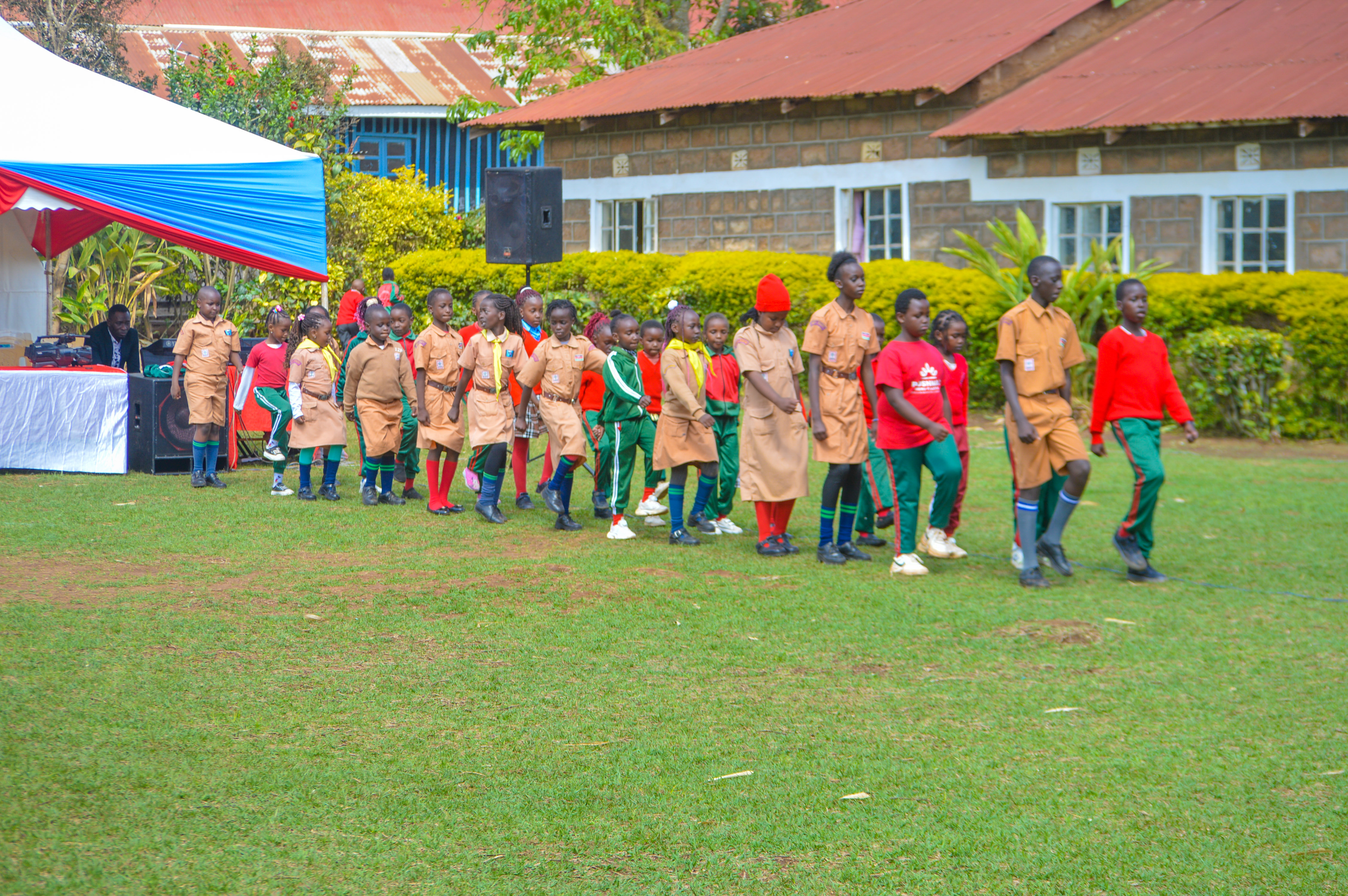 Learners marching in parade on school grounds