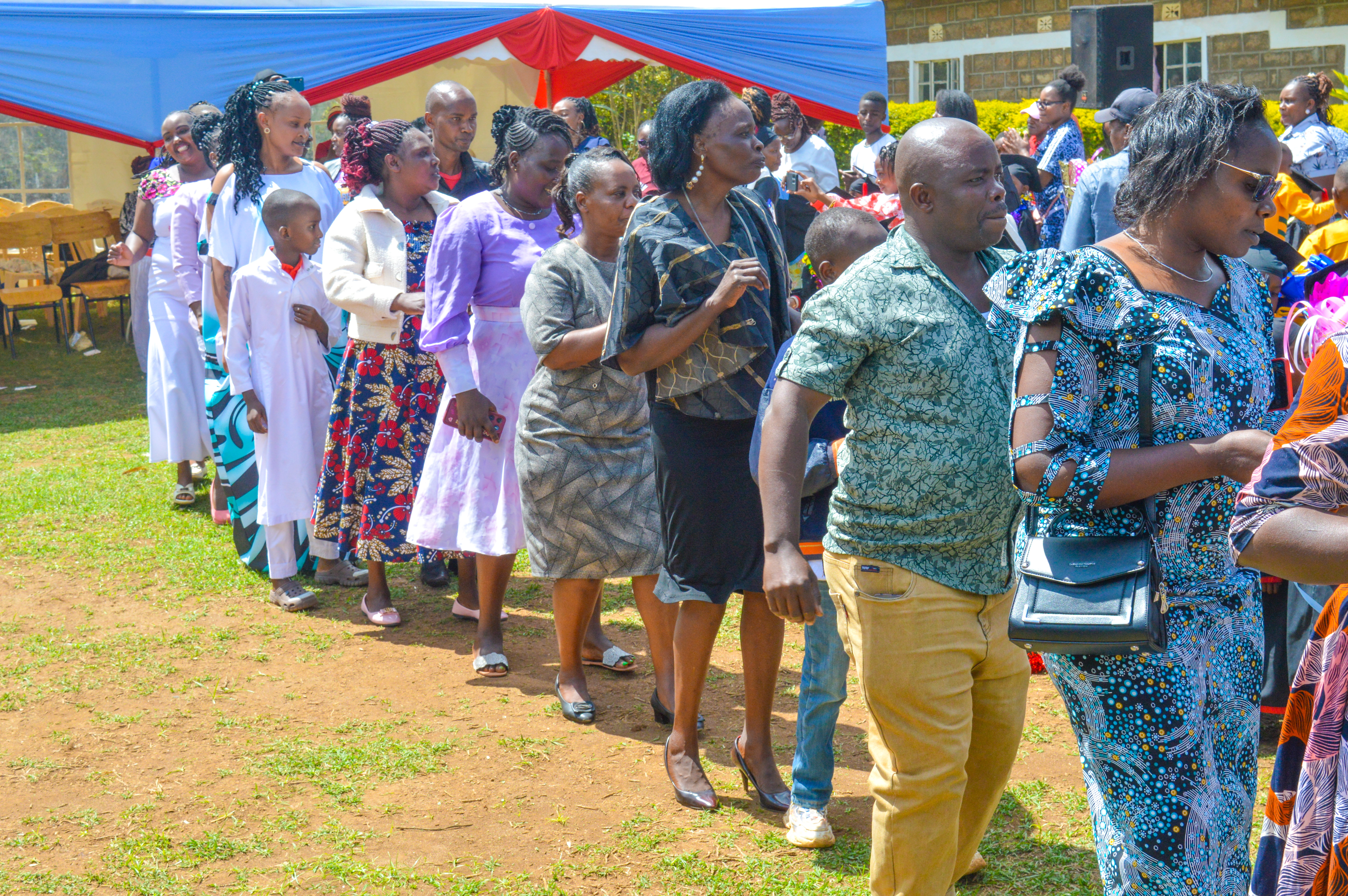 Parents and guardians participating in graduation ceremony